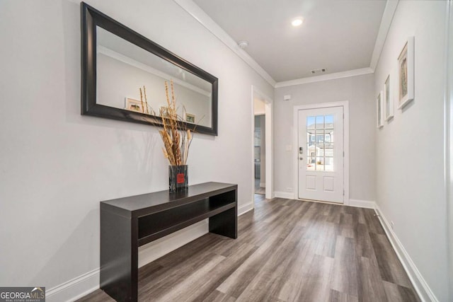 entrance foyer with wood-type flooring and crown molding