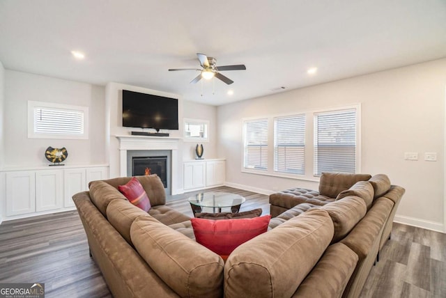 living room with hardwood / wood-style flooring and ceiling fan