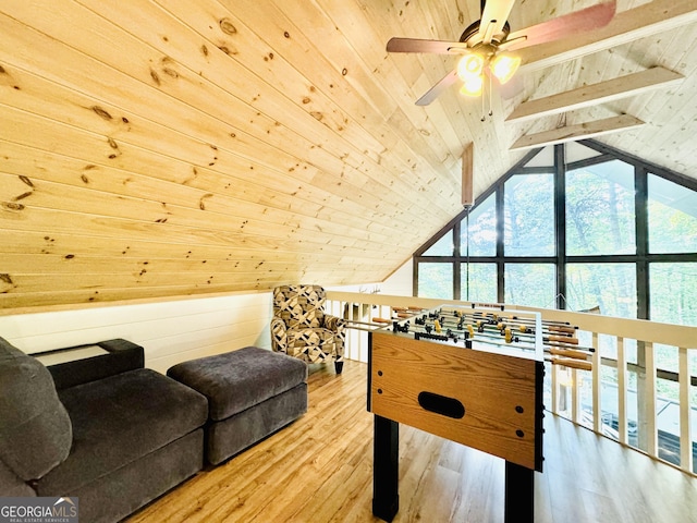 rec room with lofted ceiling with beams, ceiling fan, wood ceiling, and wood-type flooring