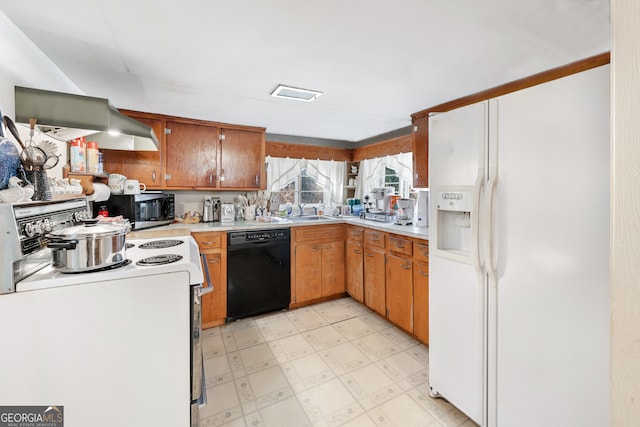 kitchen with white appliances and sink