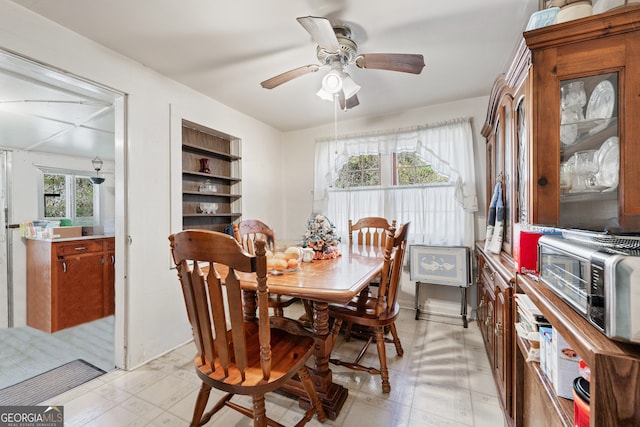 dining room with a wealth of natural light and ceiling fan