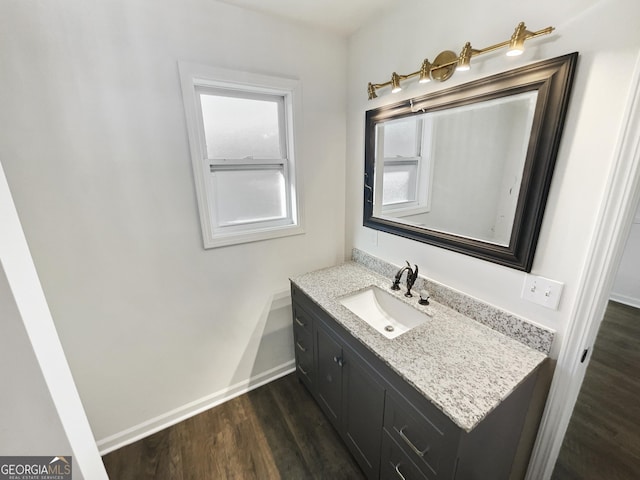 bathroom featuring hardwood / wood-style floors and vanity