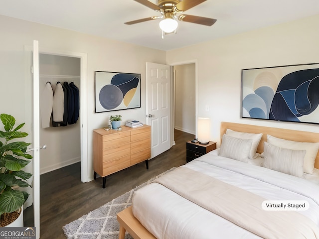 bedroom with a closet, dark hardwood / wood-style floors, and ceiling fan