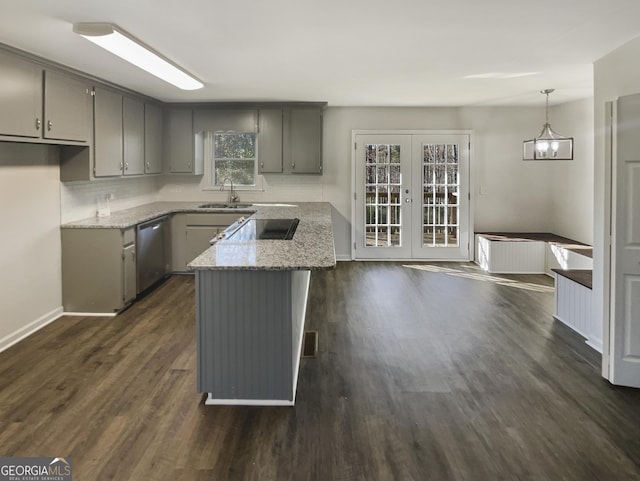 kitchen with dishwasher, french doors, light stone counters, pendant lighting, and gray cabinets