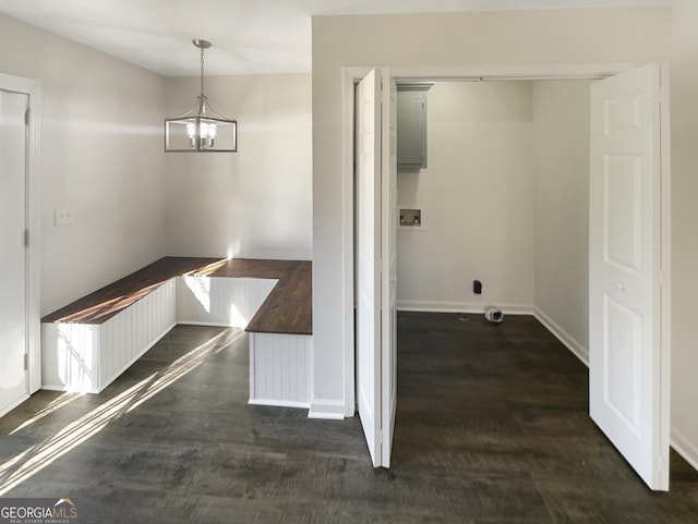 interior space with dark hardwood / wood-style floors and an inviting chandelier