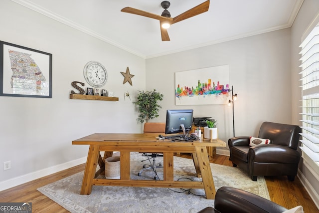 home office with ceiling fan, light hardwood / wood-style floors, and ornamental molding