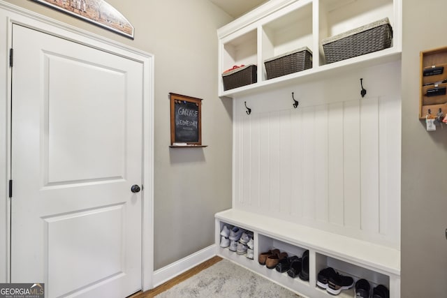 mudroom with light hardwood / wood-style floors