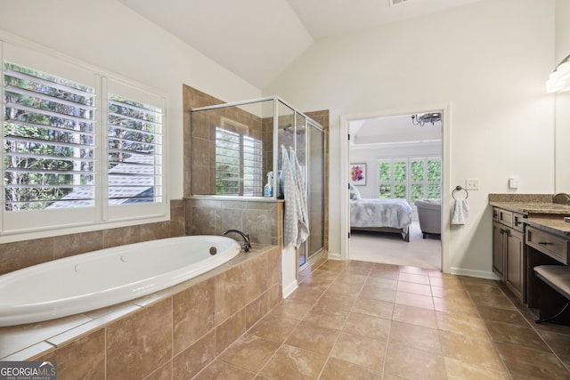 bathroom with tile patterned floors, a healthy amount of sunlight, lofted ceiling, and separate shower and tub