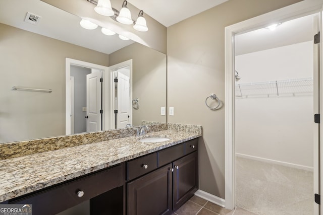 bathroom featuring tile patterned floors and vanity