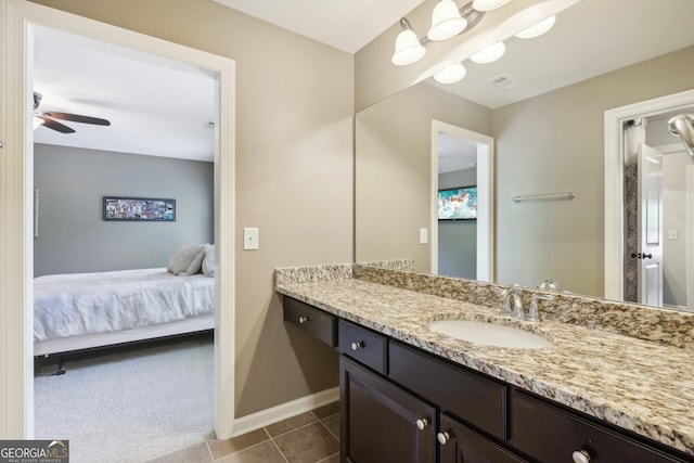 bathroom featuring tile patterned floors, ceiling fan, and vanity