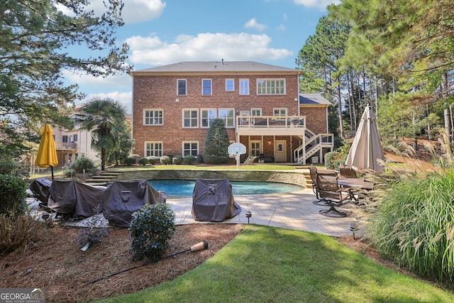 back of house featuring a patio area