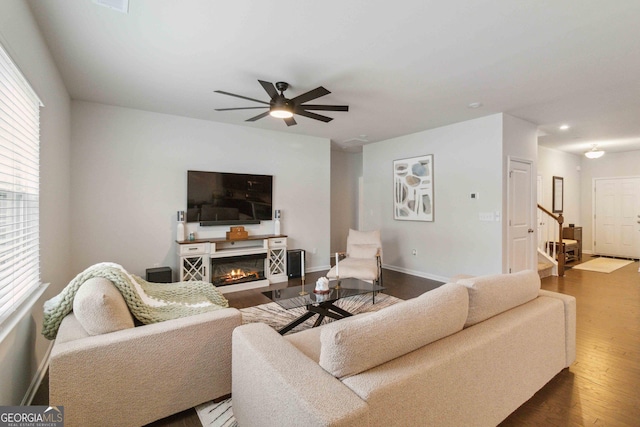 living room with ceiling fan, a healthy amount of sunlight, and hardwood / wood-style flooring