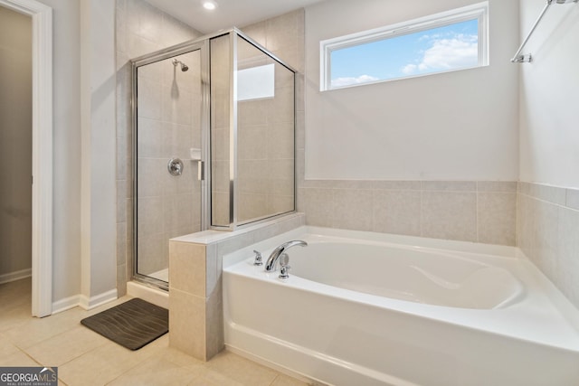 bathroom with tile patterned flooring and plus walk in shower