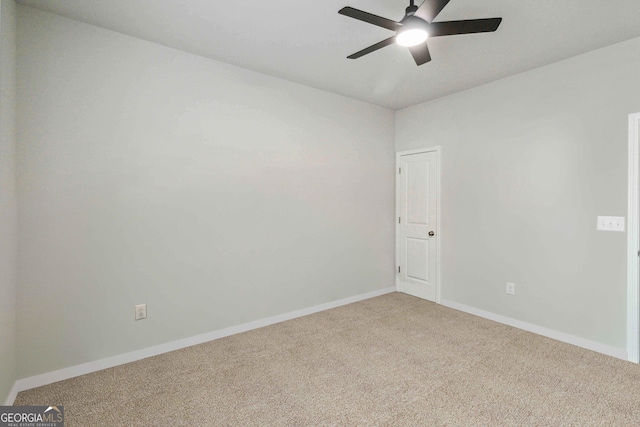 empty room featuring carpet and ceiling fan