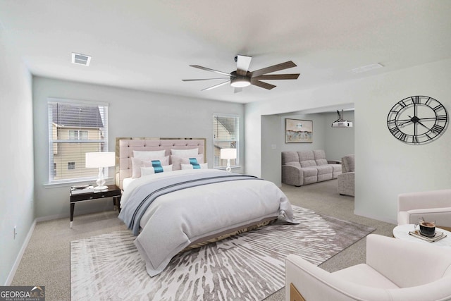 bedroom with light colored carpet and ceiling fan