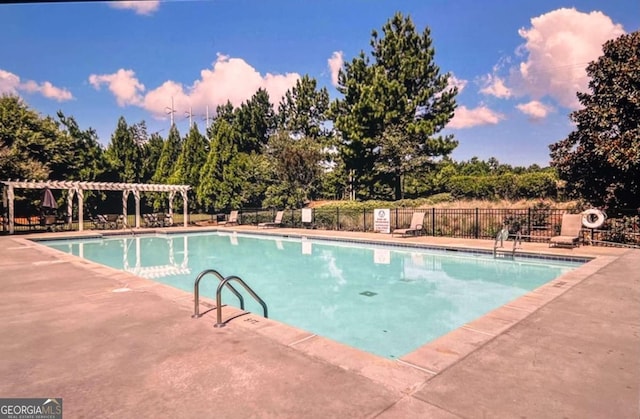 view of swimming pool with a pergola