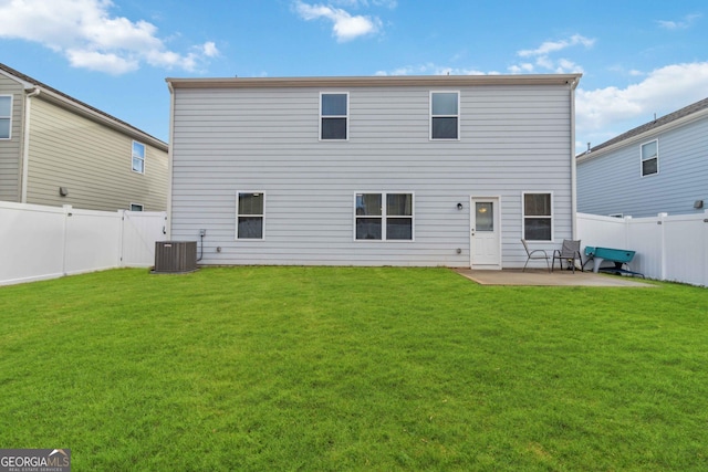 back of property with a patio, cooling unit, and a lawn