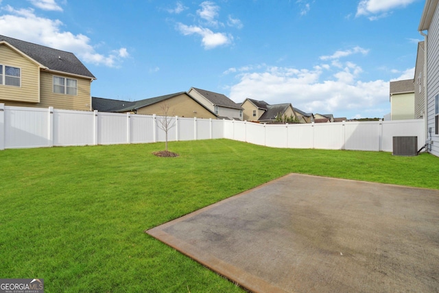 view of yard with cooling unit and a patio area