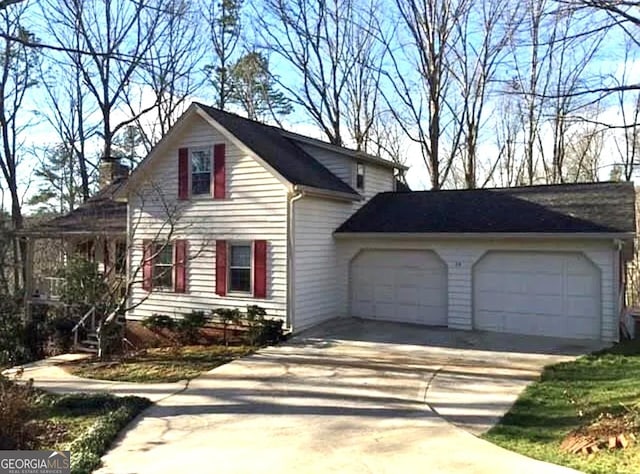 view of side of property featuring a garage