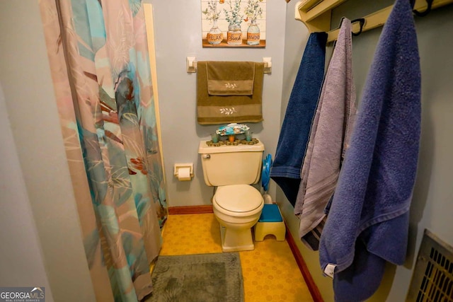 bathroom featuring toilet