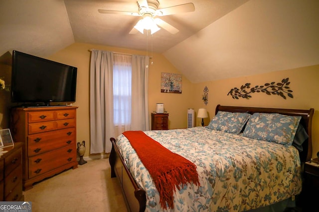 carpeted bedroom featuring vaulted ceiling and ceiling fan