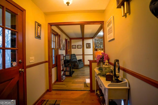 corridor with light hardwood / wood-style flooring