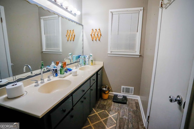 bathroom featuring hardwood / wood-style flooring and vanity