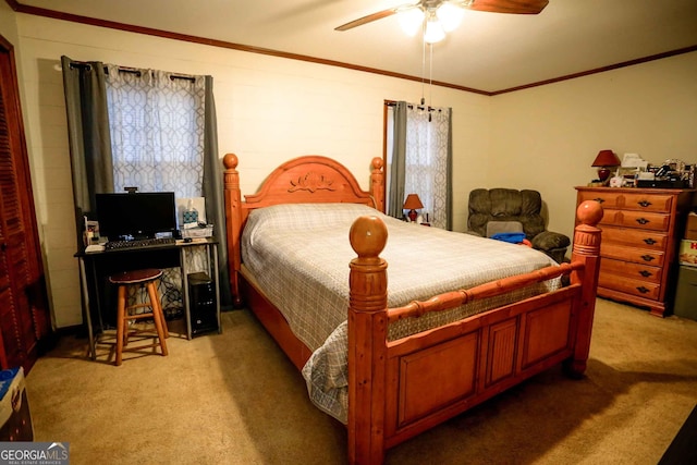 carpeted bedroom featuring ornamental molding and ceiling fan