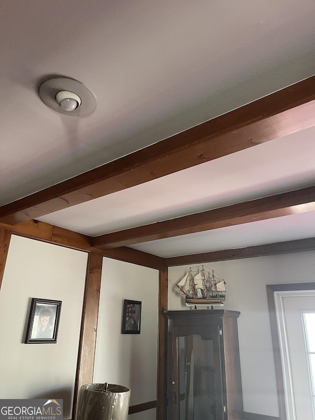 room details featuring beamed ceiling