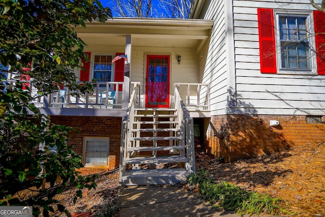 doorway to property with covered porch