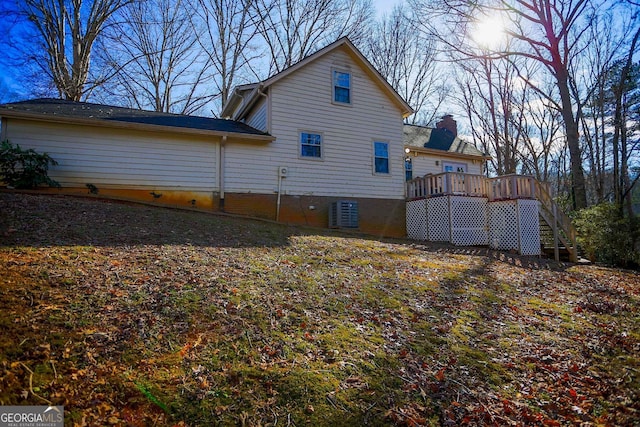 back of house featuring a deck