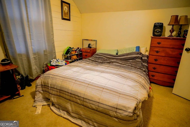 carpeted bedroom featuring vaulted ceiling