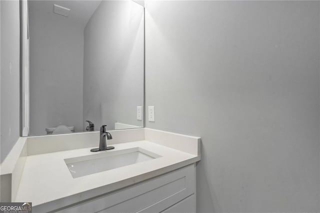 bathroom with vanity and toilet