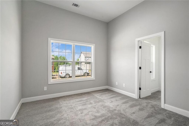 spare room featuring carpet flooring