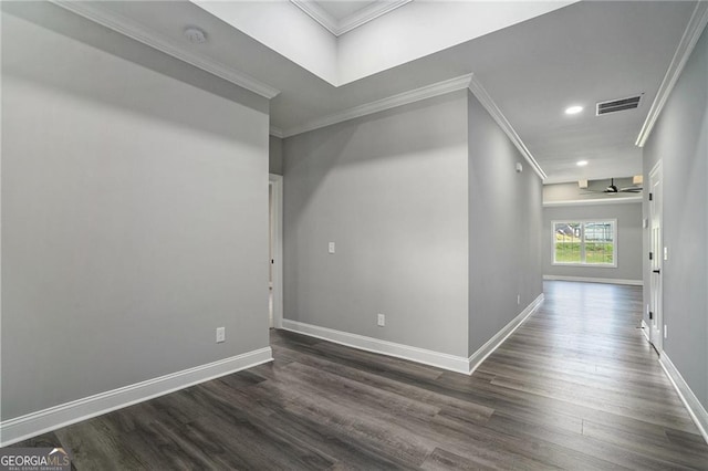 unfurnished room featuring ceiling fan, dark hardwood / wood-style floors, and ornamental molding