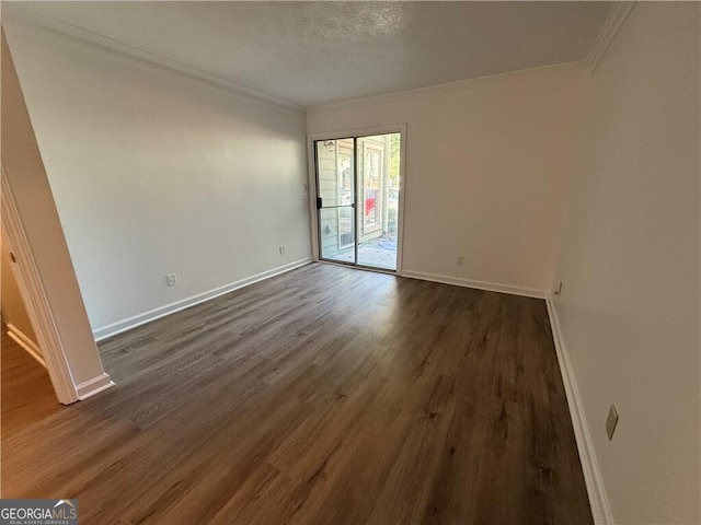 unfurnished room with a textured ceiling, dark hardwood / wood-style floors, and crown molding