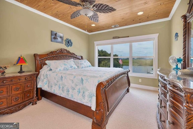 carpeted bedroom featuring ceiling fan, a water view, wood ceiling, and ornamental molding