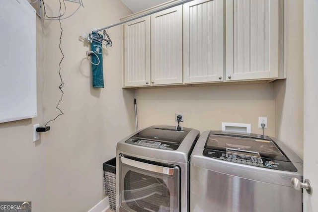 laundry area featuring cabinets and washer and dryer