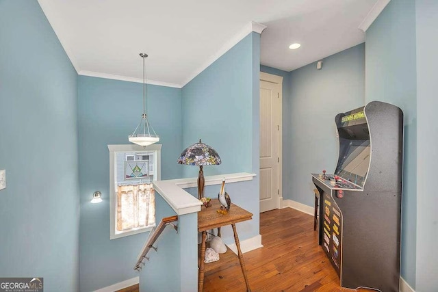 interior space with dark hardwood / wood-style floors and crown molding