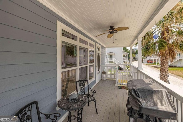 deck featuring ceiling fan and a porch