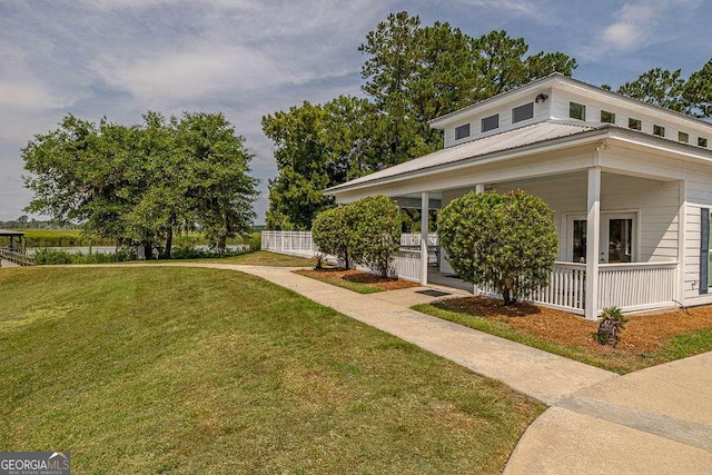 view of front of house with a front lawn and covered porch