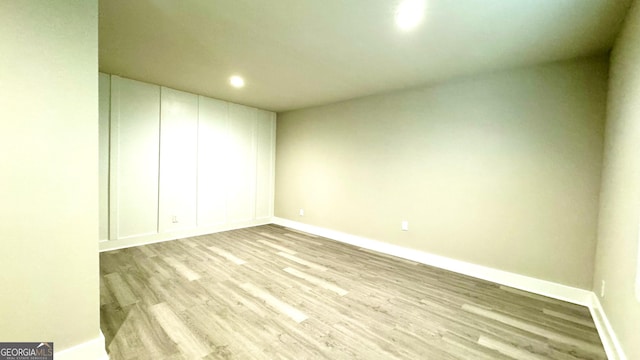 unfurnished room with light wood-type flooring