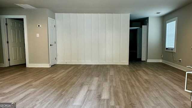 unfurnished bedroom featuring light wood-type flooring