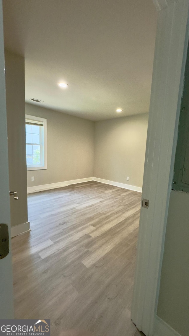 empty room featuring hardwood / wood-style flooring