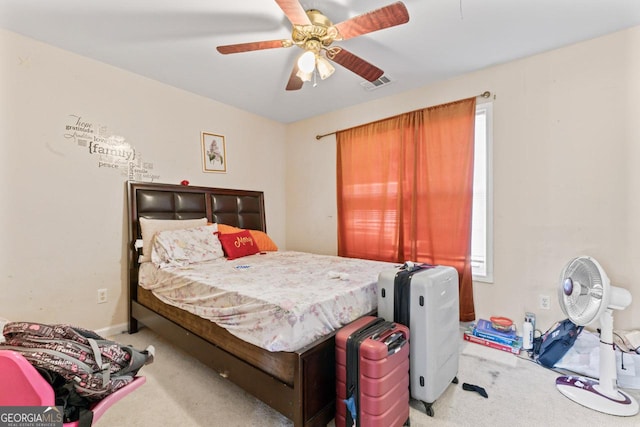 bedroom featuring ceiling fan and light carpet