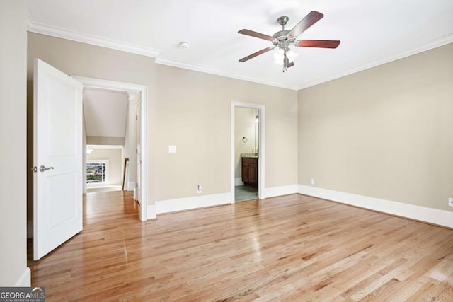 unfurnished bedroom with ceiling fan, crown molding, light wood-type flooring, and ensuite bathroom