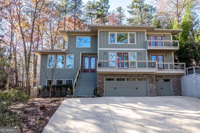 view of front of home with a garage and french doors