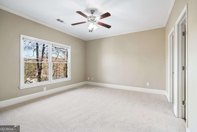 unfurnished bedroom featuring ceiling fan, crown molding, and light carpet