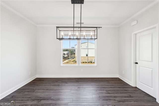 unfurnished dining area with dark hardwood / wood-style flooring, ornamental molding, and an inviting chandelier