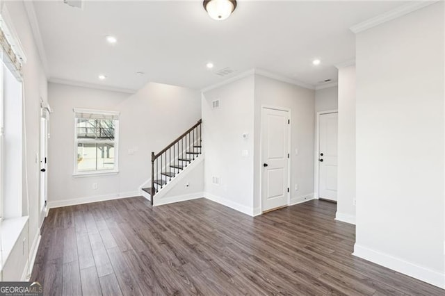 entrance foyer with dark wood-type flooring and ornamental molding